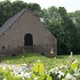Vloedschuur aan de Kornedijk. Bij dreigende overstromingen wordt het vee hier ondergebracht. Foto: Fotopersburo William Hoogteyling, Buren